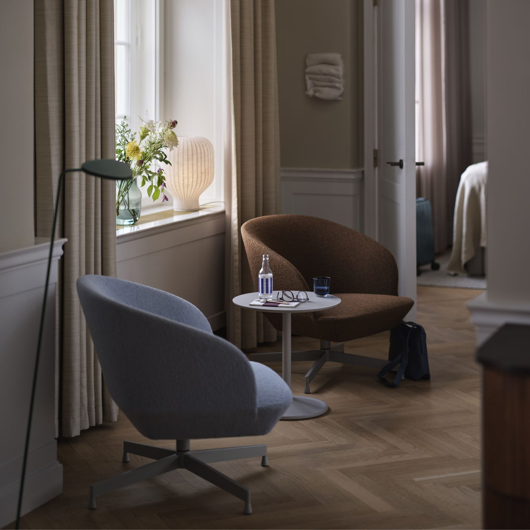 Muuto Soft Side Table Grey in Reading Nook with Oslo Swivel Chairs and Flowers