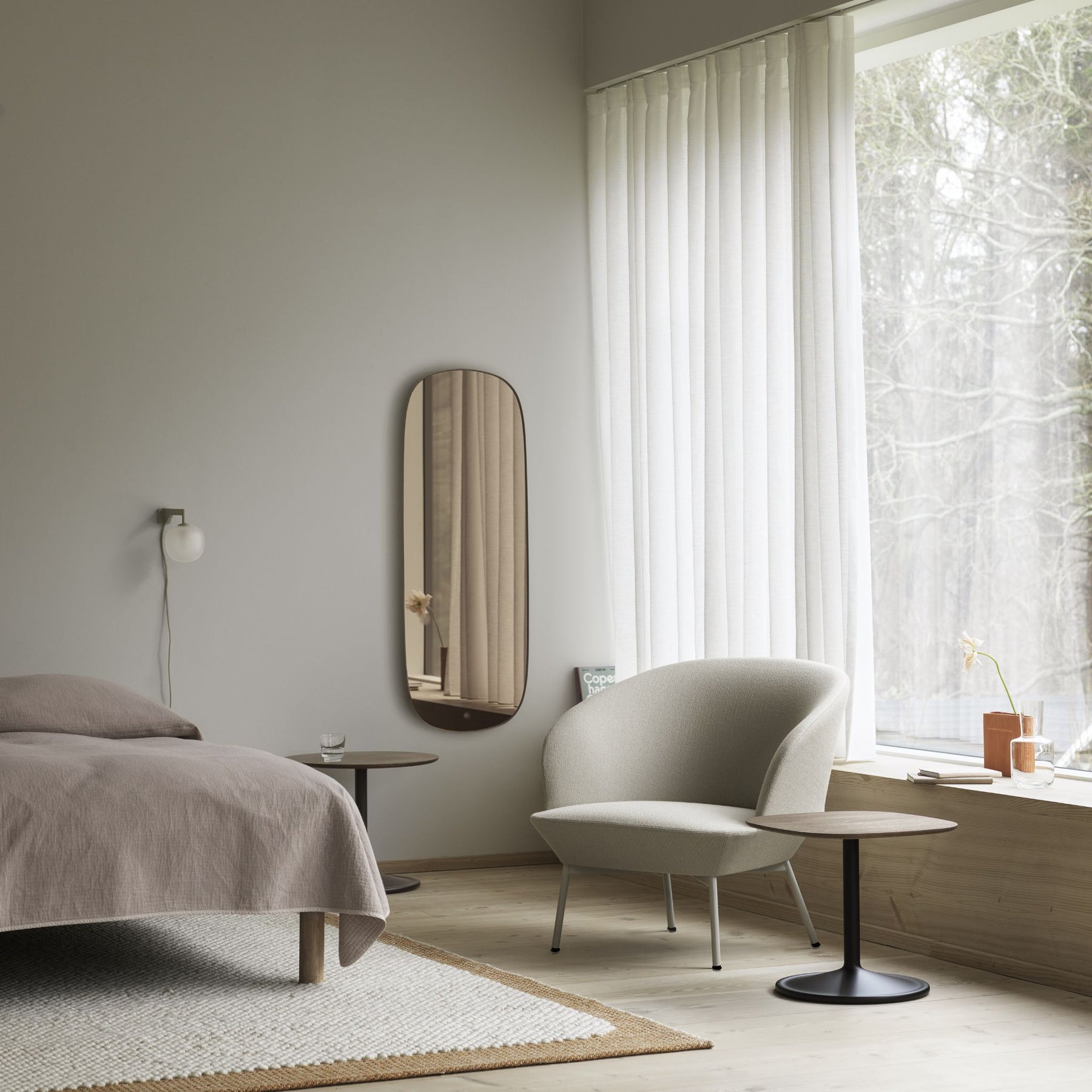 Muuto Soft Side Table Smoked Oak Top Black Base in bedroom with Oslo Lounge Chair and Mirror