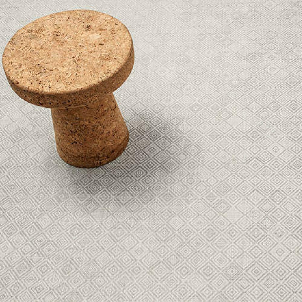 https://www.paletteandparlor.com/cdn/shop/products/chilewich-mosaic-floor-mat-grey-with-vitra-jasper-morrison-cork-stool.jpg?v=1627261735
